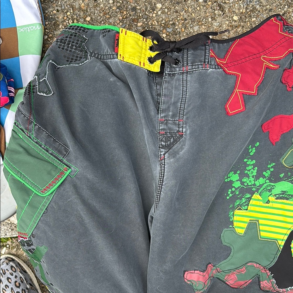 Quiksilver Gray Board Shorts with Red and Green Accents